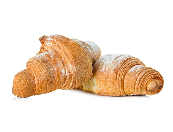 Croissant närbild på vit bakgrund — Stockfoto