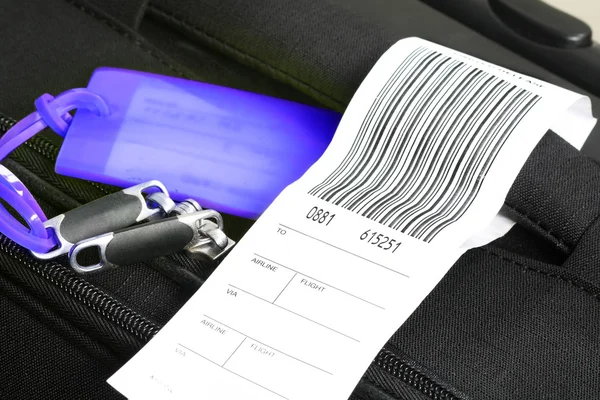 Traveling luggage with check-in label — Stock Photo, Image