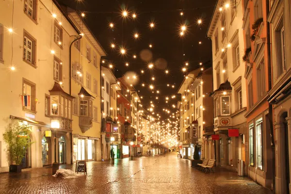 Street in a Christmas night in an old European town — Stock Photo, Image