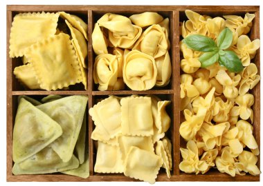 Assorted pasta with fillings in a wooden box clipart
