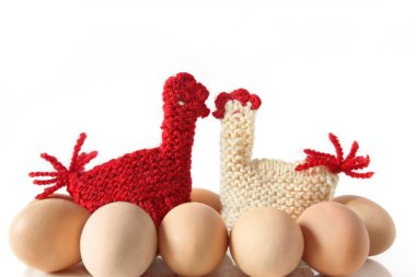 Egg Warmers in shape of knitted kissing hens clipart