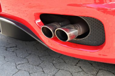Emission pipe of a red car clipart