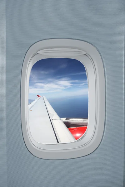 Airplane window with flight scene — Stock Photo, Image