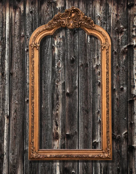 Classic mirror frame on a wooden wall — Stock Photo, Image