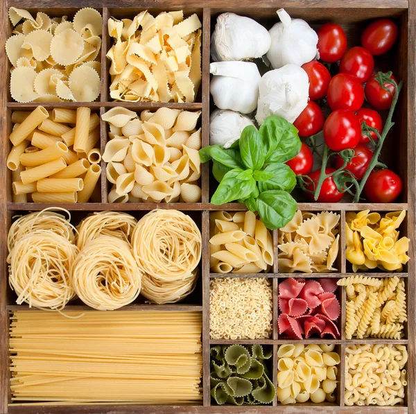 Assorted pastas in wooden box — Stock Photo, Image