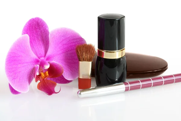 Cosmetics and an orchid — Stock Photo, Image