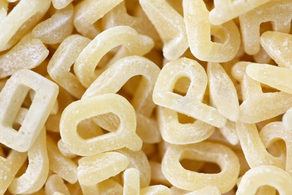 Pasta in letter form - macro and manual focus — Stock Photo, Image