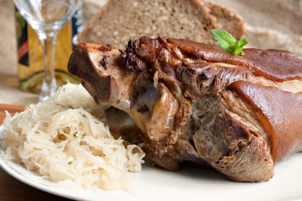 Grilled pork knuckle with sauerkraut — Stock Photo, Image