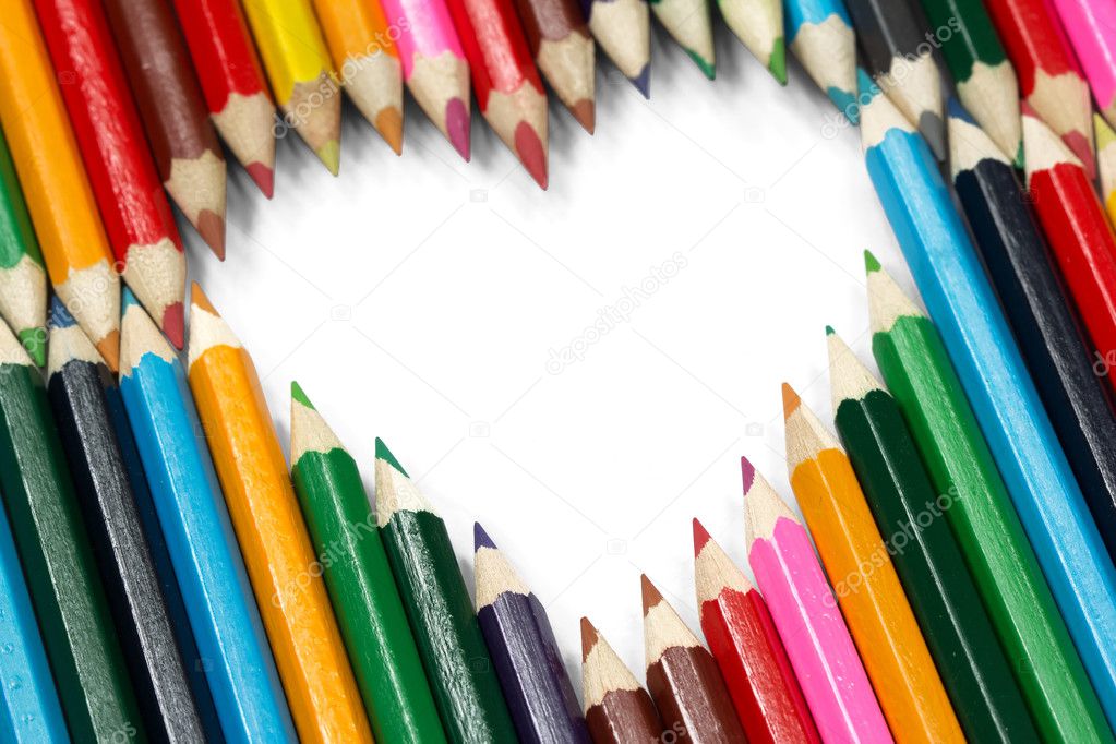 Colorful pencils forming a flying heart shape