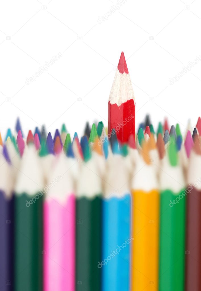 Red pencil stands out of a bunch of colorful pencils