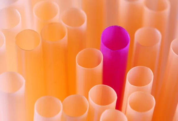 Violet straw among orange ones — Stock Photo, Image