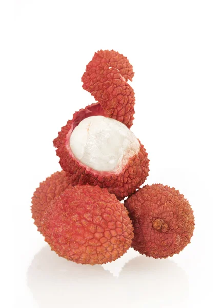 Fresh lychees with one peeled — Stock Photo, Image