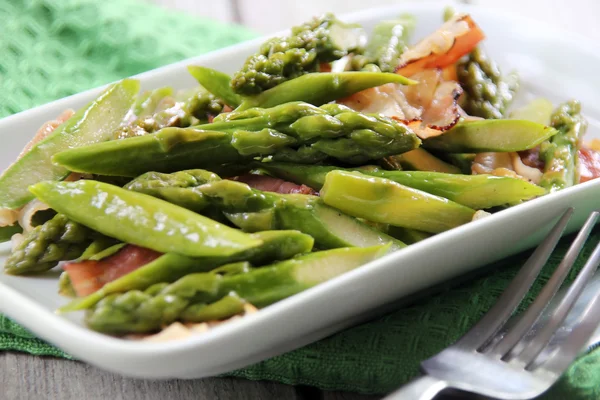 Asparagus fried with bacon cooked in Chinese way — Stock Photo, Image