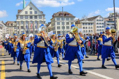 Zurich, Switzerland - 23. April 2017: Sechselauten parade. Sechselauten is a tradtional spring holiday in the city of Zurich to celebrate the winter end.  clipart
