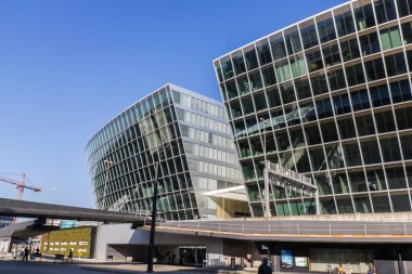 Kloten, Switzerland - 27 March 2022: Exterior of the modern building The Circle at Zurich Airport. It is a complex building for shopping and business extended to the terminals.