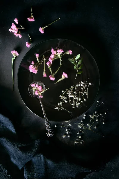 Plate Vintage Spoon Dried Flowers Black Background Dark Moody — Stockfoto