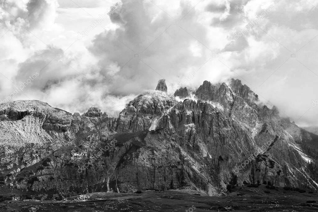 Mysterious cloud wrapping the mountains peaks of Cadini di Misurina in Dolomites, South Tyrol of Italian alps