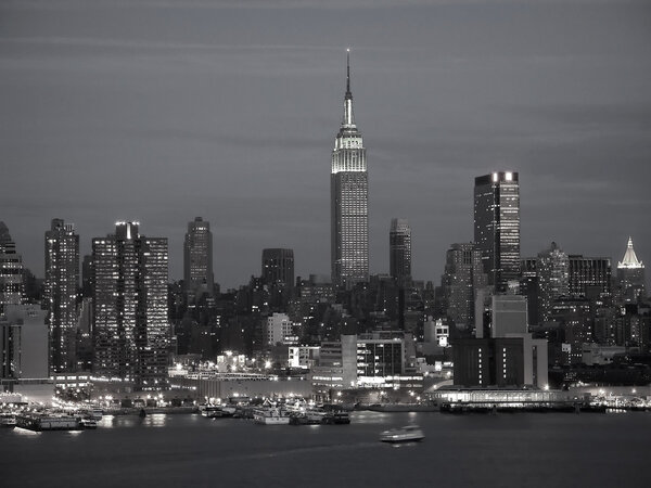 A black and white view of the New York City skyline.