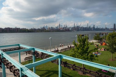 BROOKLYN -AUGUST 28 - A scenic view of the East River as seen from Domino Park on August 28 2022 in Brooklyn NY.