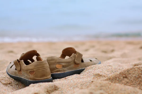 Laarzen op het zand — Stockfoto