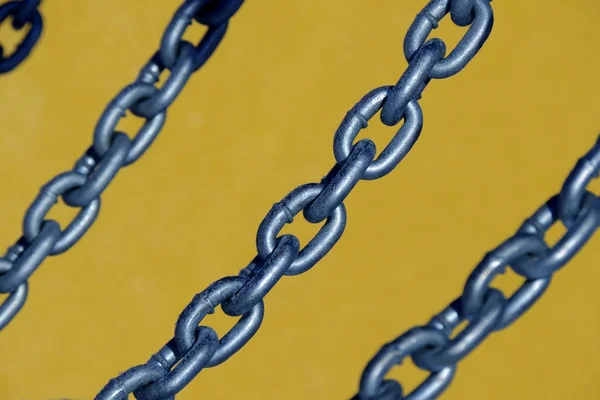 Chain on a yellow background — Stock Photo, Image
