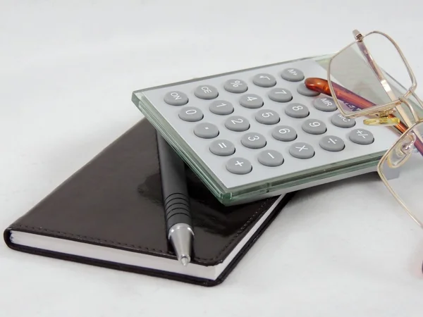Calculator with note pad — Stock Photo, Image