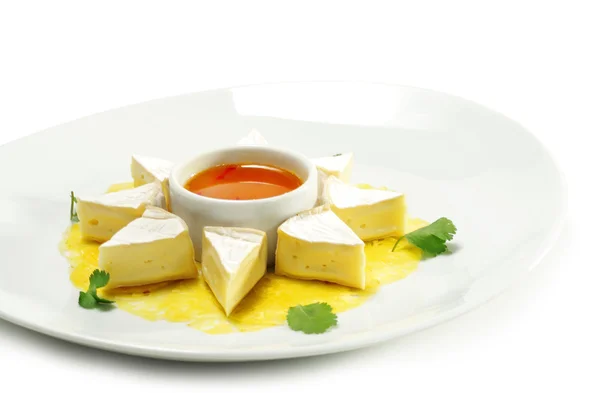 Fromage sýr s medovou pomerančovou omáčkou — Stock fotografie