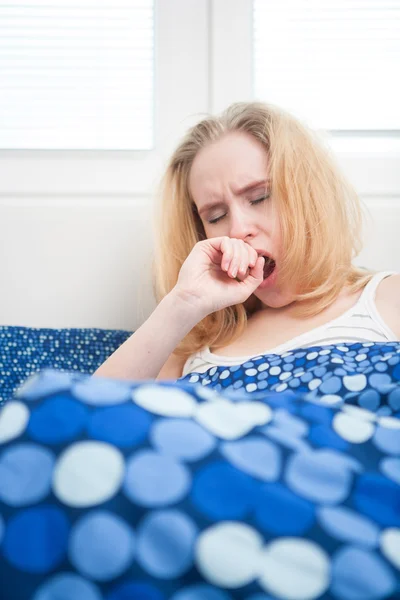 Caucasian woman in bed, getting up late to work with terrible headache — Stock Photo, Image