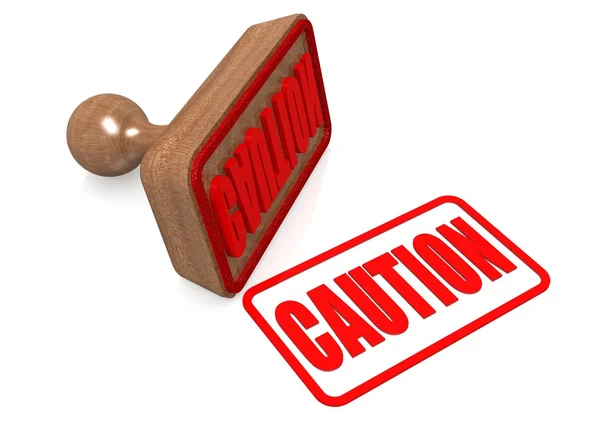 Caution word on wooden stamp — Stock Photo, Image
