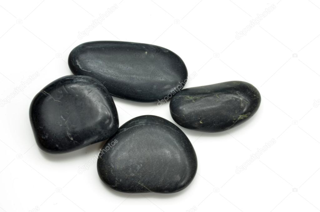 Stack of black stones indicate the concept of balance