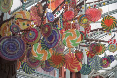 Singapore Jan 08 2022: Worm's-eye view decorate large colorful candy lollipop tree of Candylicious shop at Sentosa Island.