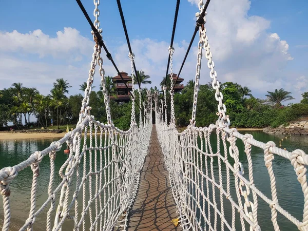 stock image Singapore- Apr 2, 2022: Palawan Beach hanging bridge in Sentosa, Singapore. Palawan Beach lies in the centre of the southern coast of Sentosa, Singapore.