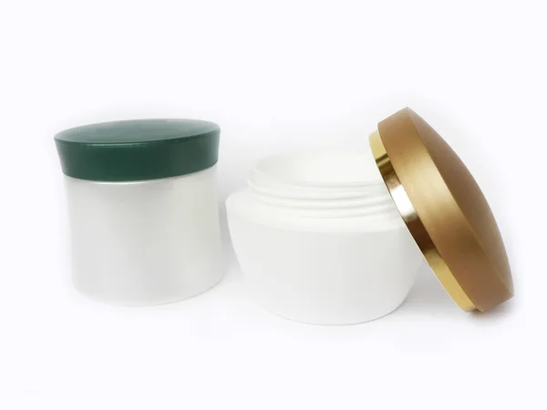 Beyaz arka plan üzerinde izole boş beyaz krem kavanoz