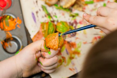 Making colored palm. Bouquet of dried bends and flowers. An Easter palm is a traditional Polish and Lithuanian symbolic decoration associated with Palm Sunday.