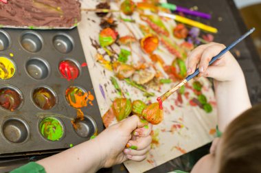 Making colored palm. Bouquet of dried bends and flowers. An Easter palm is a traditional Polish and Lithuanian symbolic decoration associated with Palm Sunday.
