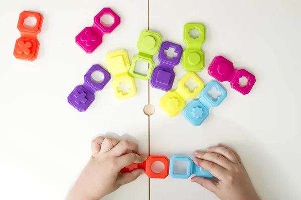 Colorful Domino Shapes Game Childs Hand Part Connecting Puzzle Pieces — Foto de Stock