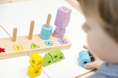 Learning counting, shapes and colors. Montessori type implement. wooden toys.