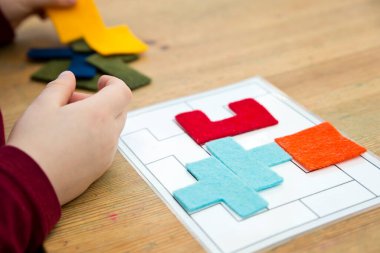 Matching the shapes. Logic game for brain activity training. Children home activity. Early education, fine motoric skills. Primary school exercises.