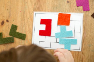 Matching the shapes. Logic game for brain activity training. Children home activity. Early education, fine motoric skills. Primary school exercises.