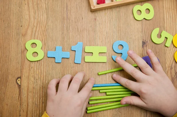 Favorite Math Tools and Toys for Preschool and Kindergarten. Wooden counting sticks, numbers and equation symbols.