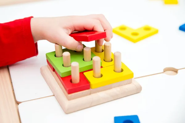 Matching the shapes. 3D wooden constructor. Implement for learning to count. Addition and subtraction exercises. Montessori methodology for nursery and preschool children.