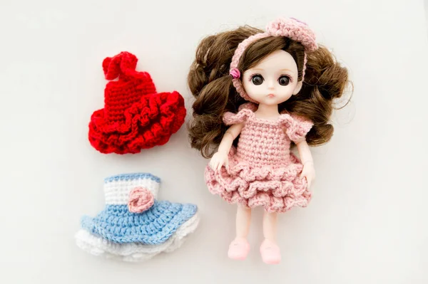 Baby girl cute doll with colorful hand crocheted knitting dress.