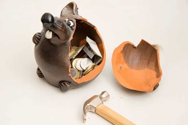 Broken piggy bank with money on white background. Saving savings at home. Finance, saving, investing. Money management at home. The concept of financial business.