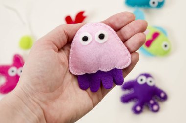 Hand made stuffed felt toy. Fishing rod with magnet and fishes or other sea animals. Different colors. Safe eco stuffed toy for infants and toddlers. Early education implement.