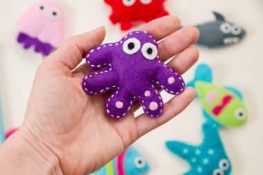 Hand made stuffed felt toy. Fishing rod with magnet and fishes or other sea animals. Different colors. Safe eco stuffed toy for infants and toddlers. Early education implement.