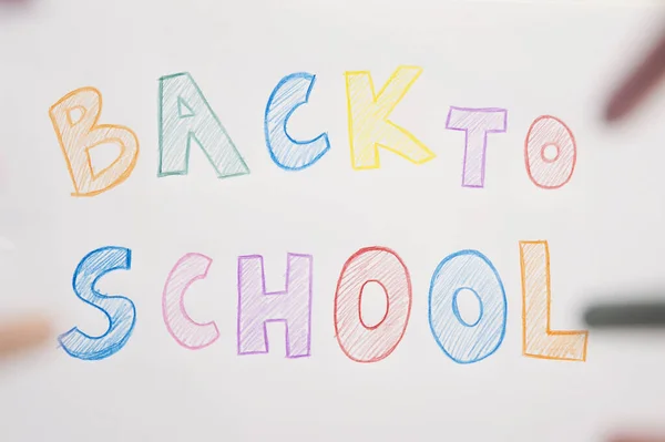 I don\'t want to go back to school. On white A4 paper sheet written words with different color pencils. Summer ending and new study year beginning.