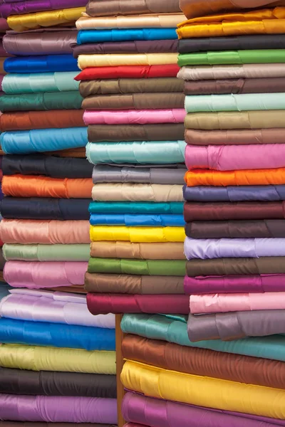 Stacked colorful fabrics — Stock Photo, Image