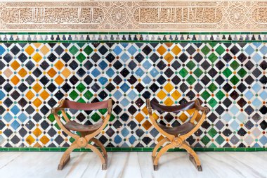 Colourful tiled background in the courtyard of the Moorish styled palace of Alhambra in Granada, Spain