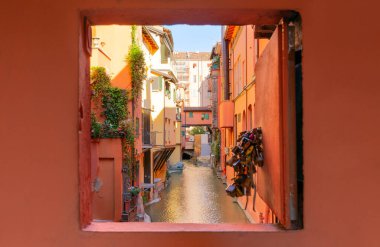 Secret window in the wall to the hidden part of the city in Bologna, Italy. Canal of Reno in Piella street clipart