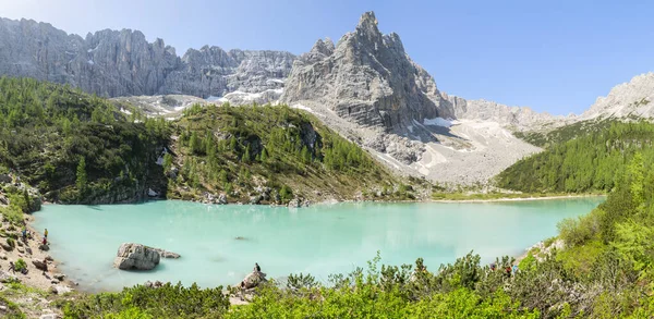 Wonderful hiking, photography and recreation place. Famous lake Sorapis with high snowy mountains at sunset, Dolomites, Italy, Europe